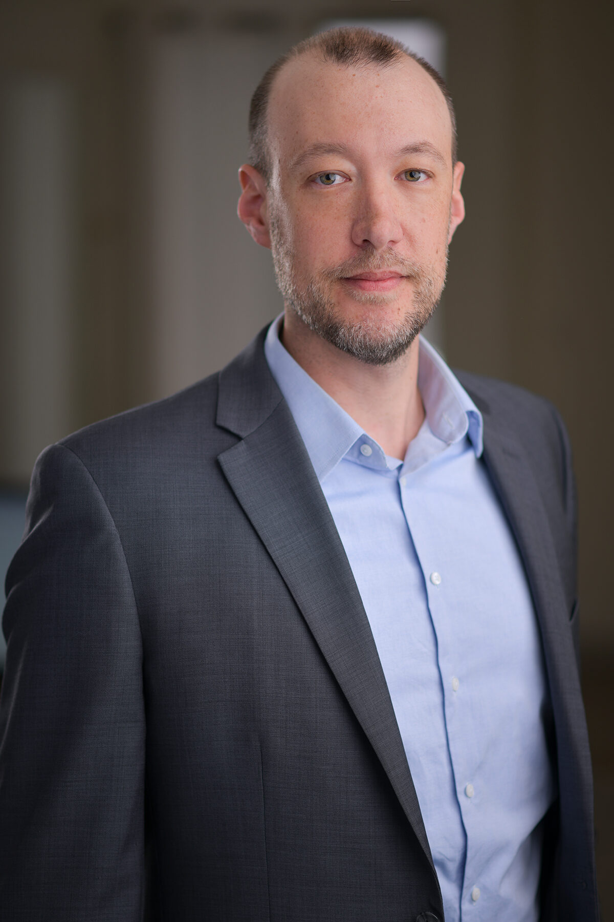 Simon Anderson professional portrait, gray suit
